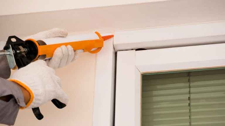 applying caulk with a dripless caulking gun