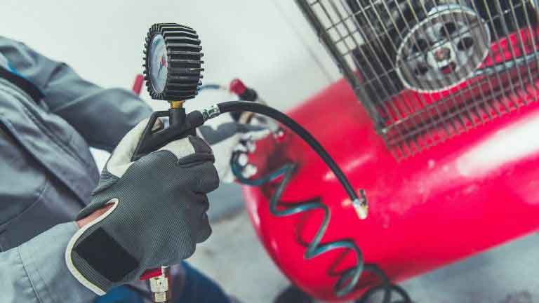 mobile auto detailer configuring the air compressor for detailing project