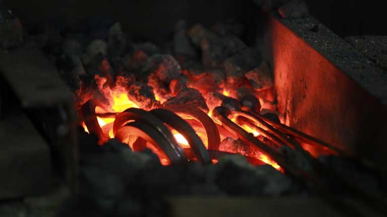 metal tools heating inside the forge